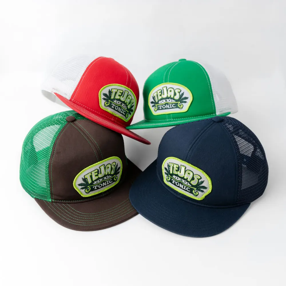 Tejas Tonic branded trucker hats in red, green, brown and navy